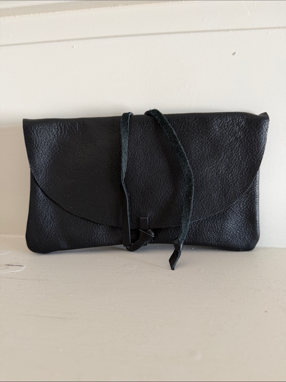 Sleek Black Leather Tie-Front Wristlet Clutch
